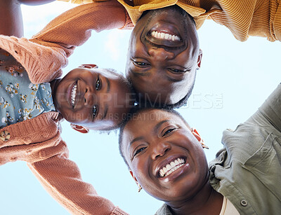 Buy stock photo Shot of a young couple and their daughter standing together outside