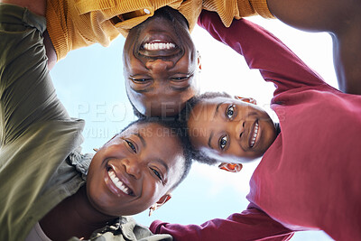 Buy stock photo Smile, huddle and portrait of black family with support, blue sky and bonding together in nature. Low angle, face and parents with man and woman for childhood, solidarity and fun or joy with embrace