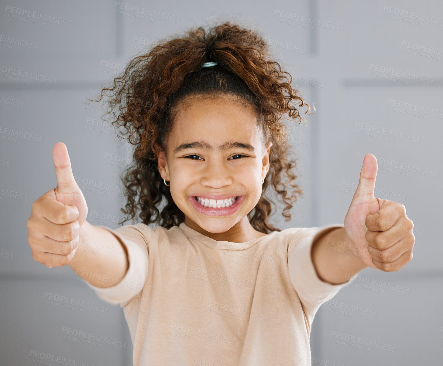 Buy stock photo Cropped portrait of an adorable little girl gesturing thumbs up towards the camera