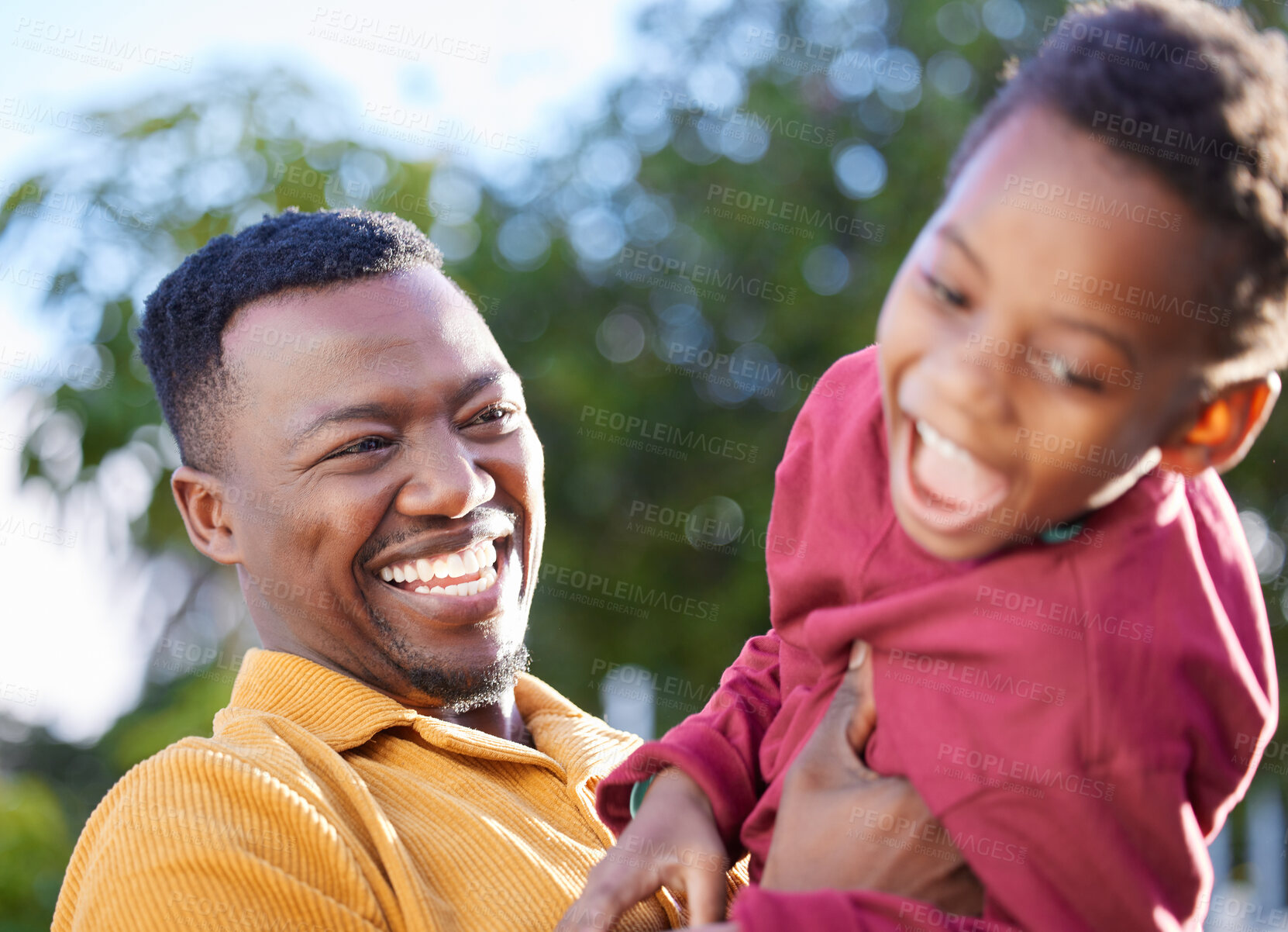 Buy stock photo Father, laugh and black man tickle son, have fun and enjoy happy bonding together in outdoor park. Family, child love and playing African people, kid and papa tickling boy with game in backyard