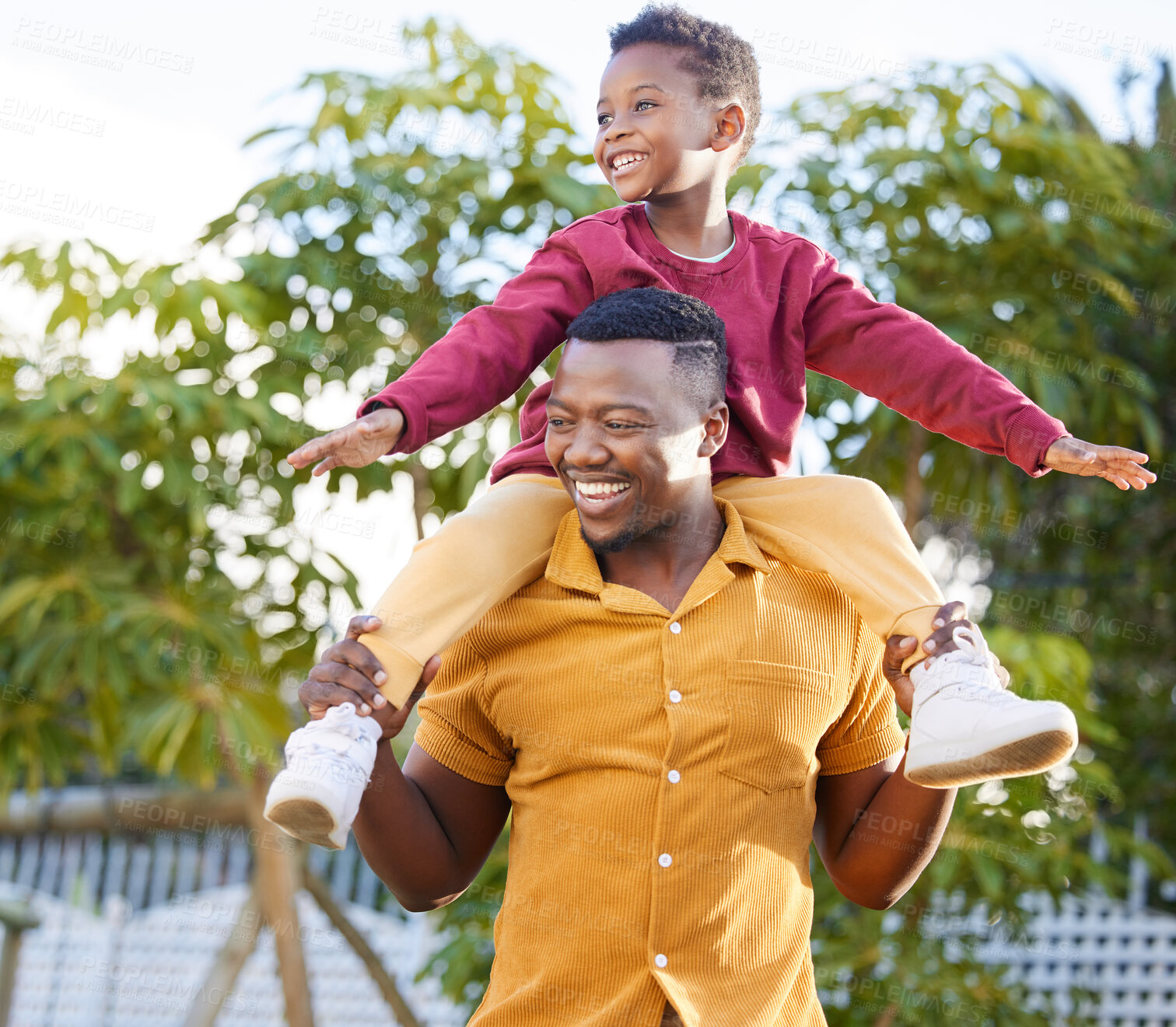 Buy stock photo Father, smile and black man piggyback kid, fun and joy happy bonding together in outdoor park. Family, child love and playing African people, son and papa carrying boy with game in backyard garden