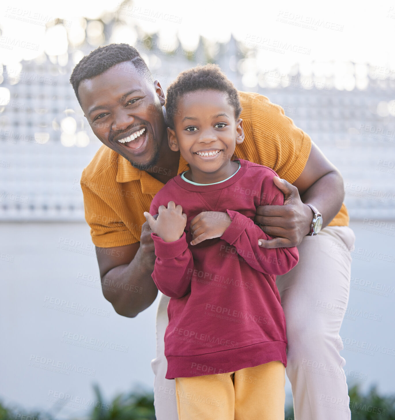 Buy stock photo Father, smile and black man embrace kid for portrait, joy or happy bonding together in outdoor park. Family, child love and playing African people, son and papa hug boy with game in backyard garden