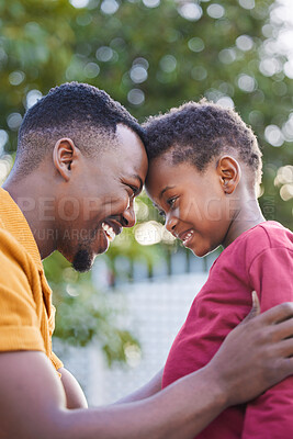 Buy stock photo African father, happy kid and touch forehead for love, care and family bonding with boy in garden. Dad, child and smile of parent at backyard for support, connection and healthy relationship outdoor