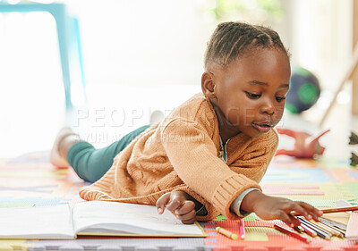 Buy stock photo Shot of a little girl relaxing and drawing