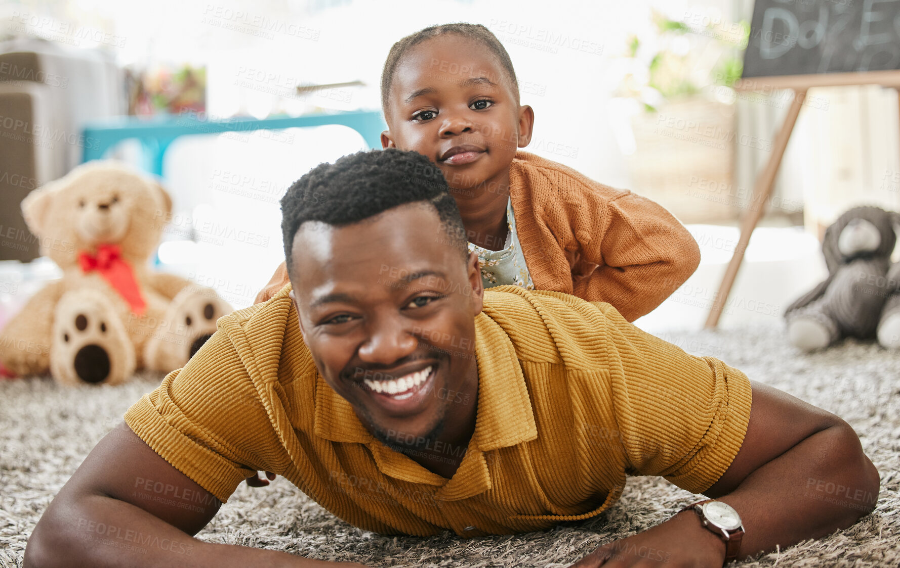 Buy stock photo Black man, teacher and kid with playing in kindergarten with toys for fun, education and child development. People, educator and happy on floor at school with support, care and help in day care