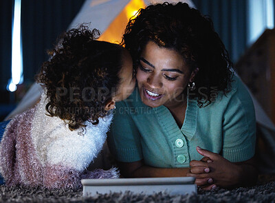 Buy stock photo Happy mom, tablet and kiss child in home for care, connection or relax together. Mama, girl and love with kid on tech for family bonding, support and smile of parent at night on floor for motherhood