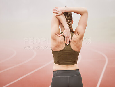 Buy stock photo Rearview shot of an unrecognizable young female athlete stretching while out on the track