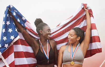 Buy stock photo Cropped shot of two attractive young female athletes celebrating their country's victory