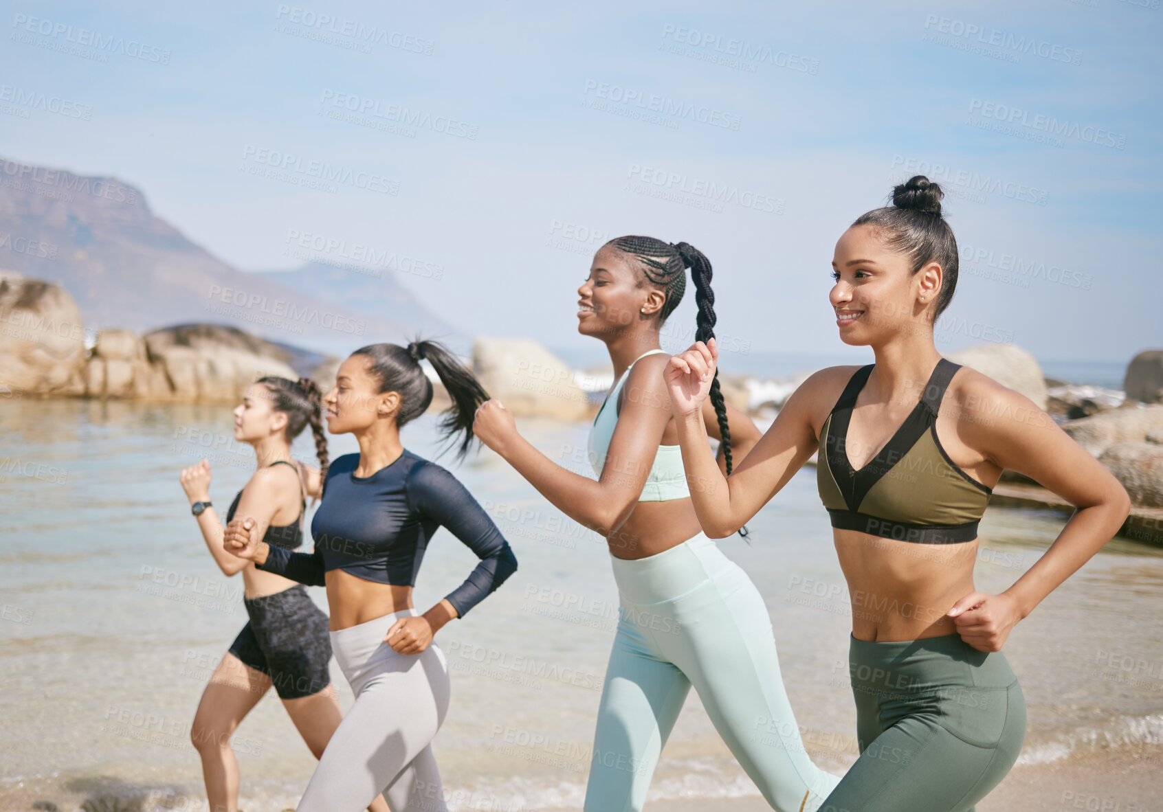 Buy stock photo Fitness, running and group of women by beach for workout in morning with exercise community. Health, sports and female athletes with cardio by ocean or sea for endurance, speed and physical training.