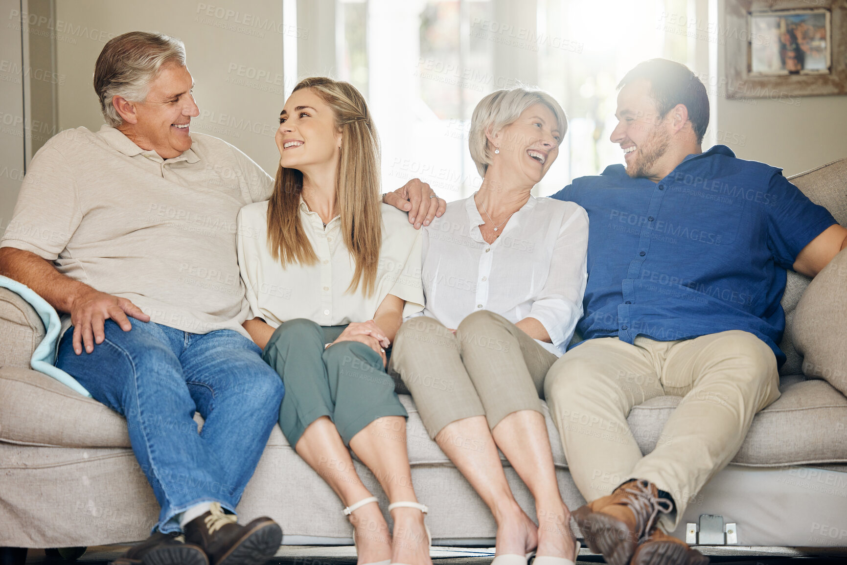 Buy stock photo Happy family, parents and adult children on sofa in home with bonding, laughing and relax with love in living room. Women, men and affection on couch in lounge for weekend visit, excited and caring