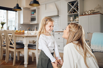 Buy stock photo Shot of a mother and daughter talking at home