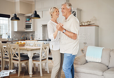 Buy stock photo Shot of a happy senior couple dancing at home