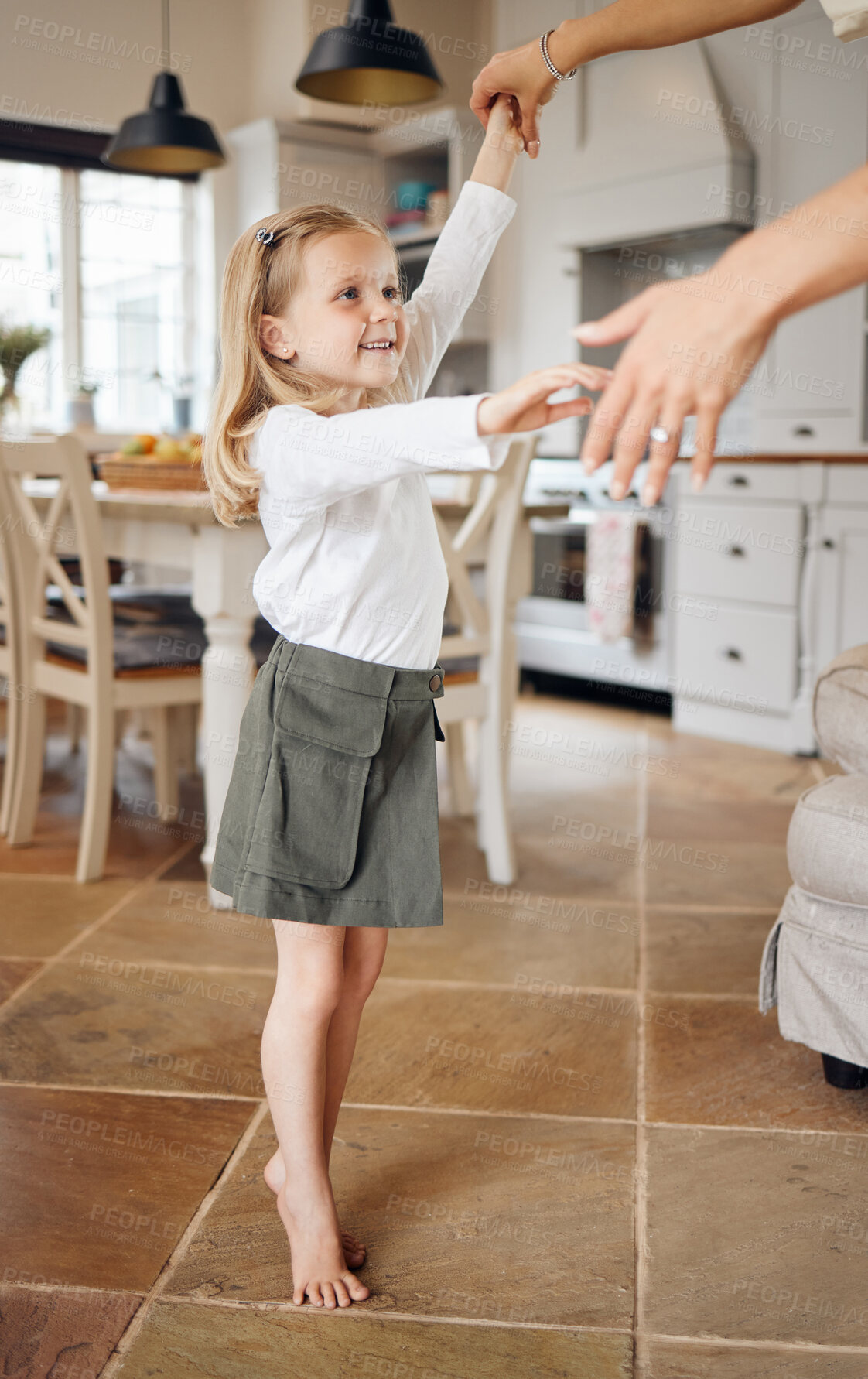 Buy stock photo Dancing, happy and child with parent in home with music, song or radio for bonding together. Smile, fun and hands of person with girl kid for groove, care or connection in dining room at family house