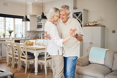 Buy stock photo Shot of a happy senior couple dancing at home