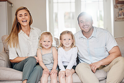 Buy stock photo Shot of a young family on the couch at home