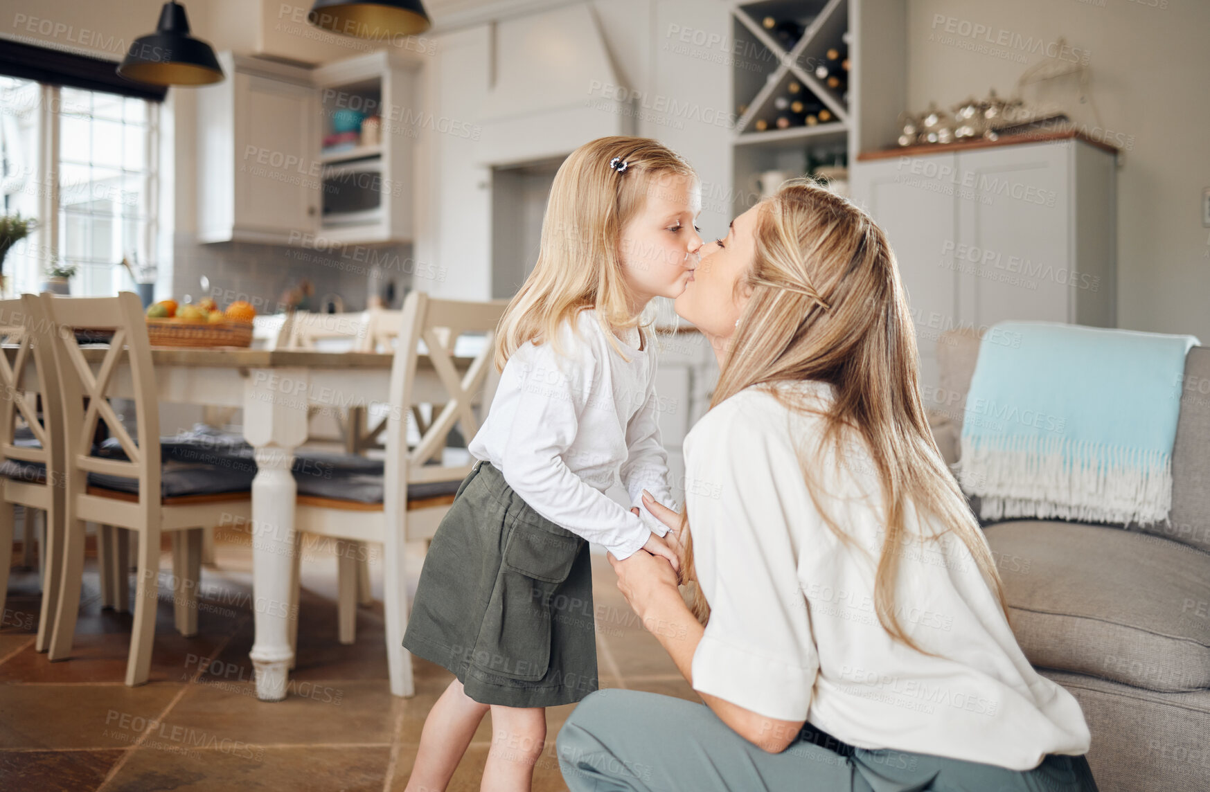 Buy stock photo Love, home and child kissing mother for connection, care and bonding together in lounge for sweet moment. Happy, family and girl kid embracing mom for greeting in living room at house in Australia.