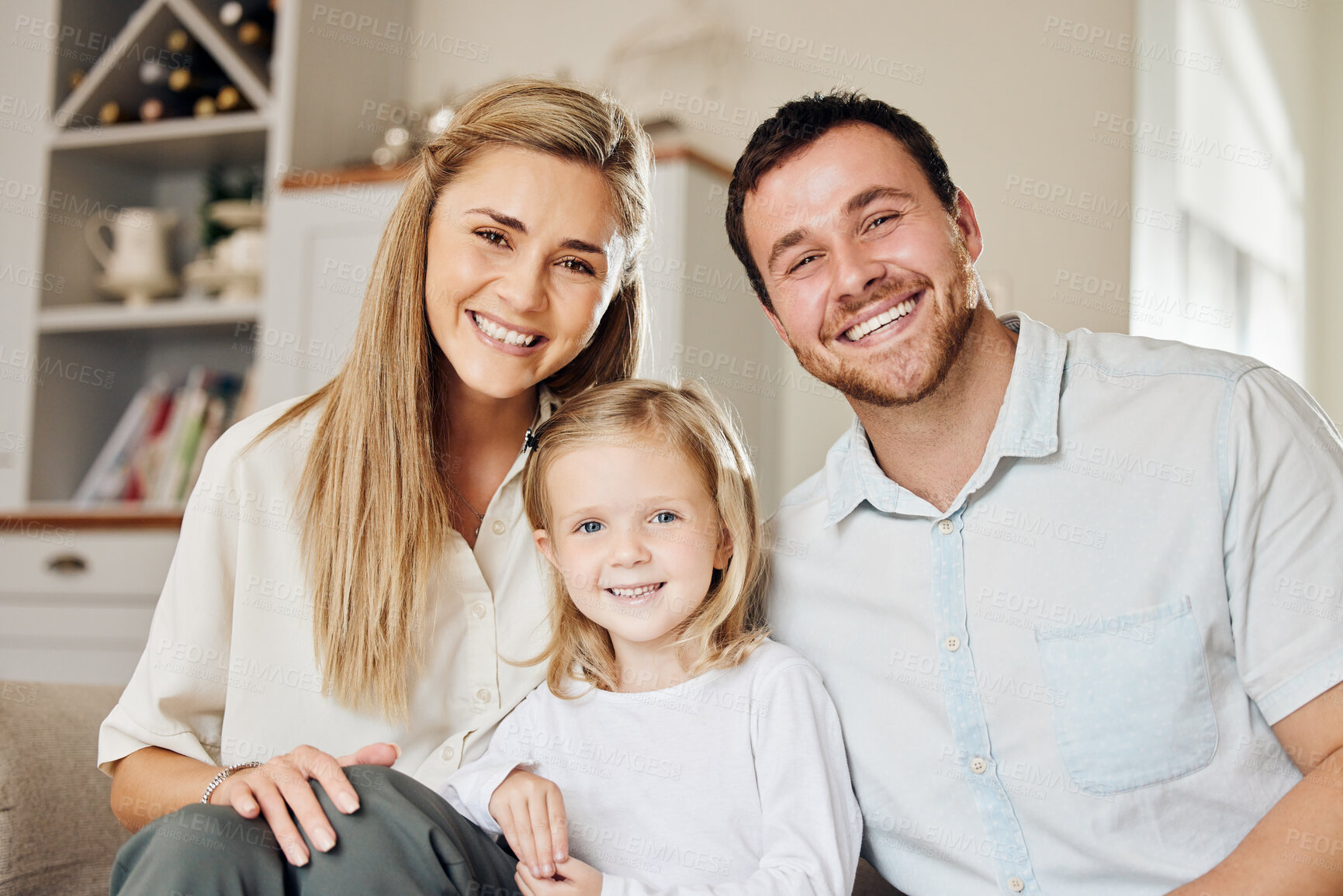 Buy stock photo Happy family, portrait and parents with girl on sofa in home for bonding, laughing and relax with love in living room. Smile, daughter and parenthood on couch in lounge on weekend, excited and caring