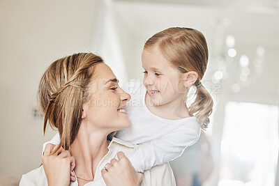 Buy stock photo Shot of a mother and daughter playing at home