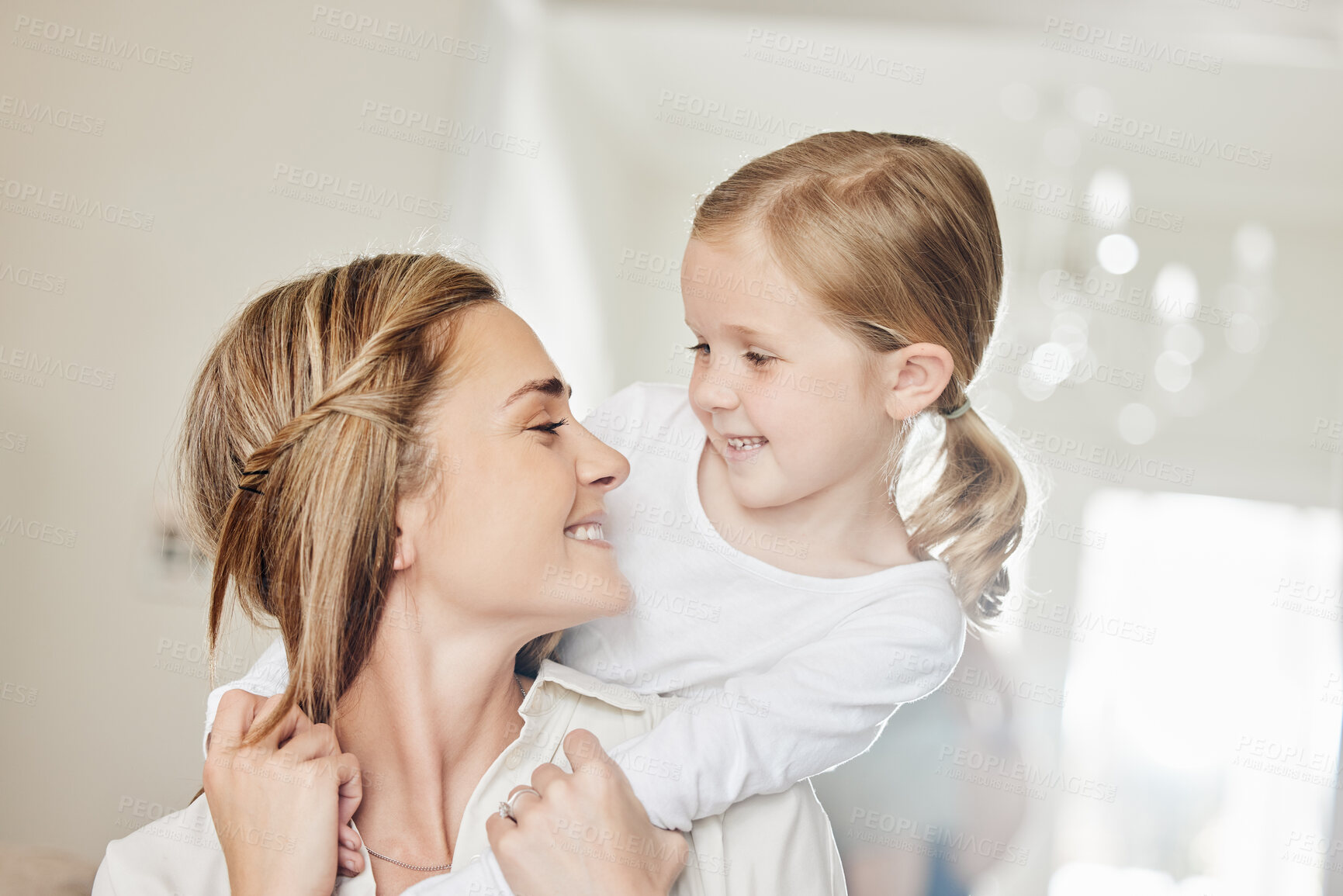 Buy stock photo Smile, girl and woman with hug in home for childhood connection, care and bonding together on weekend. House, family and mom with embrace of daughter in living room for motherhood, happiness and love