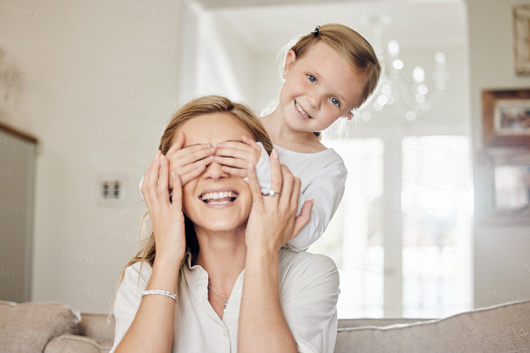 Buy stock photo Mom, kid and hands covering eyes in living room for happy surprise, fun and playful bonding together. Smile, mother and daughter in home with guess who game for playing, trust and relax in apartment