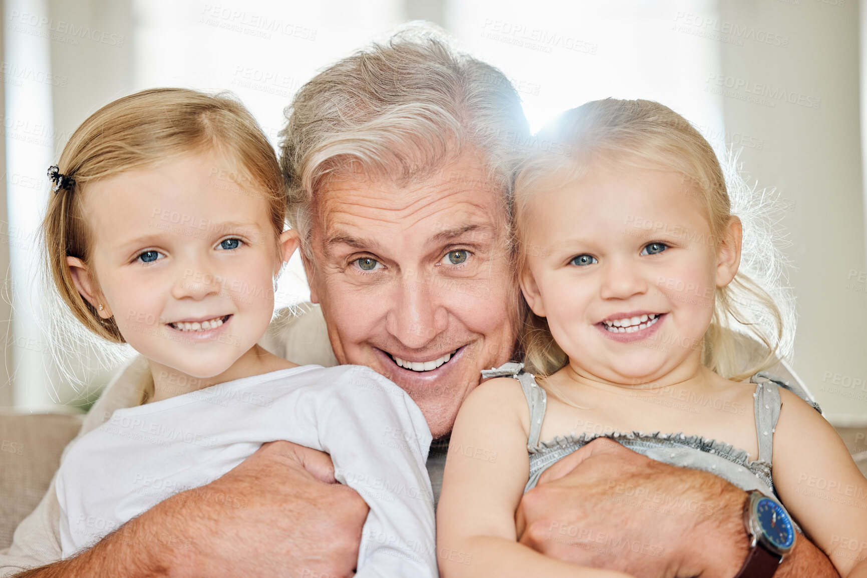 Buy stock photo Shot of a grandpa and his granddaughters at home