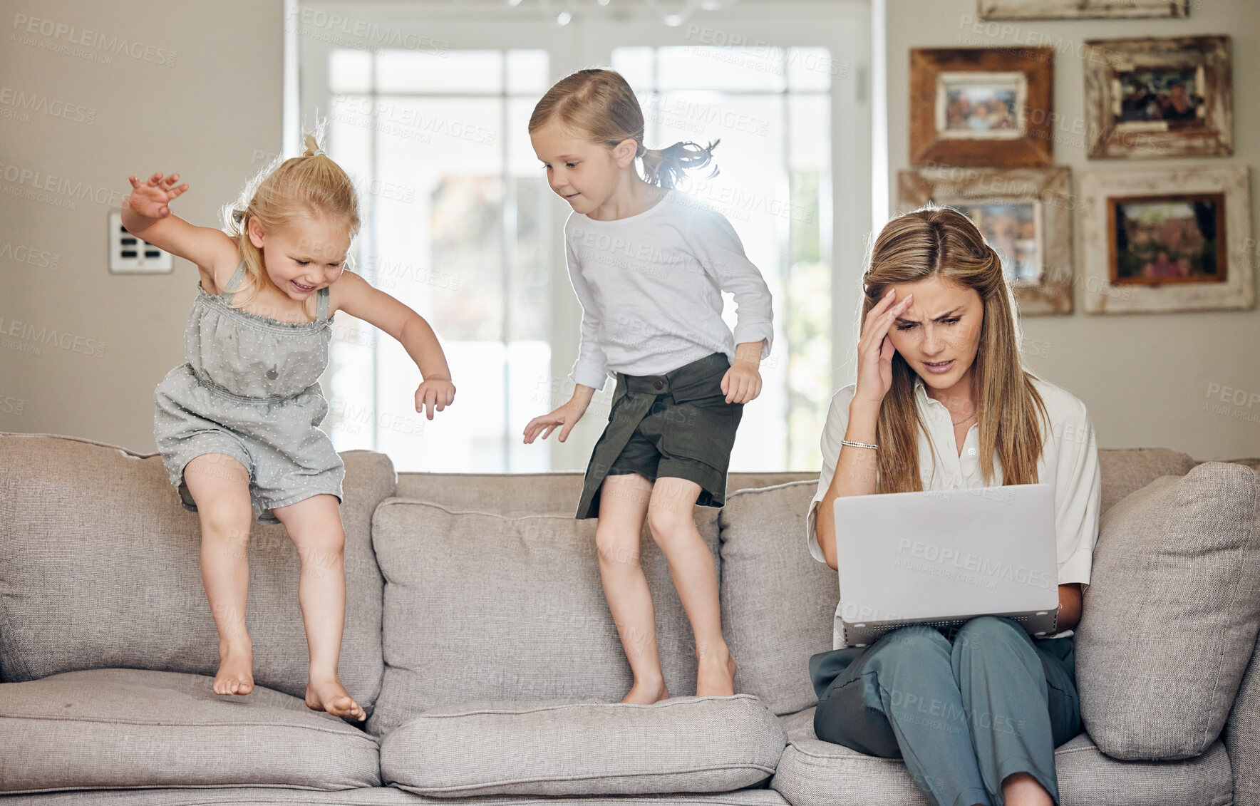 Buy stock photo Children, playing and mother with stress or laptop on sofa with chaos, noise and frustrated with remote work. Energy, woman and kids want attention with jumping on couch, burnout and headache in home