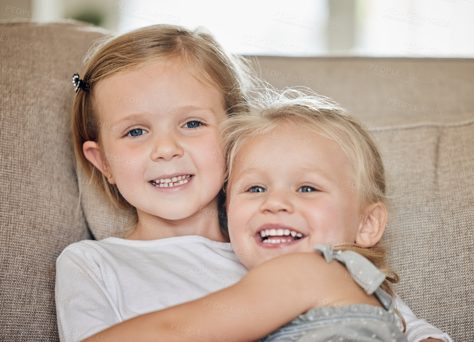 Buy stock photo Home, sibling and portrait of children on sofa for love, support and bonding together on weekend. Happy, hug and girls with smile on face in living room for and care, comfort connection in sisterhood