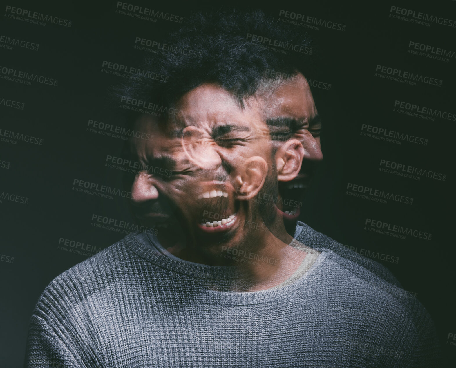 Buy stock photo Studio shot of a young man experiencing mental anguish and screaming against a black background