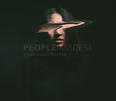 Buy stock photo Shot of a young woman with her face distorted against a black background