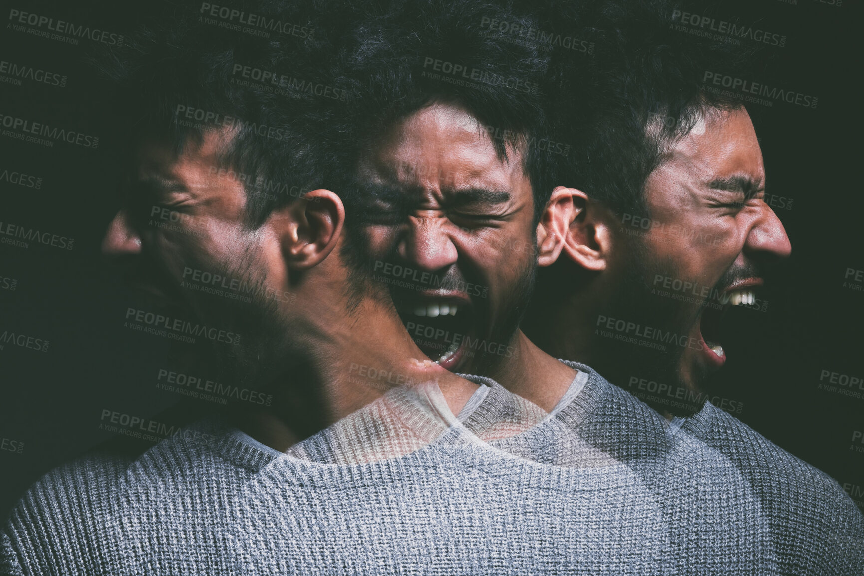 Buy stock photo Studio shot of a young man experiencing mental anguish and screaming against a black background