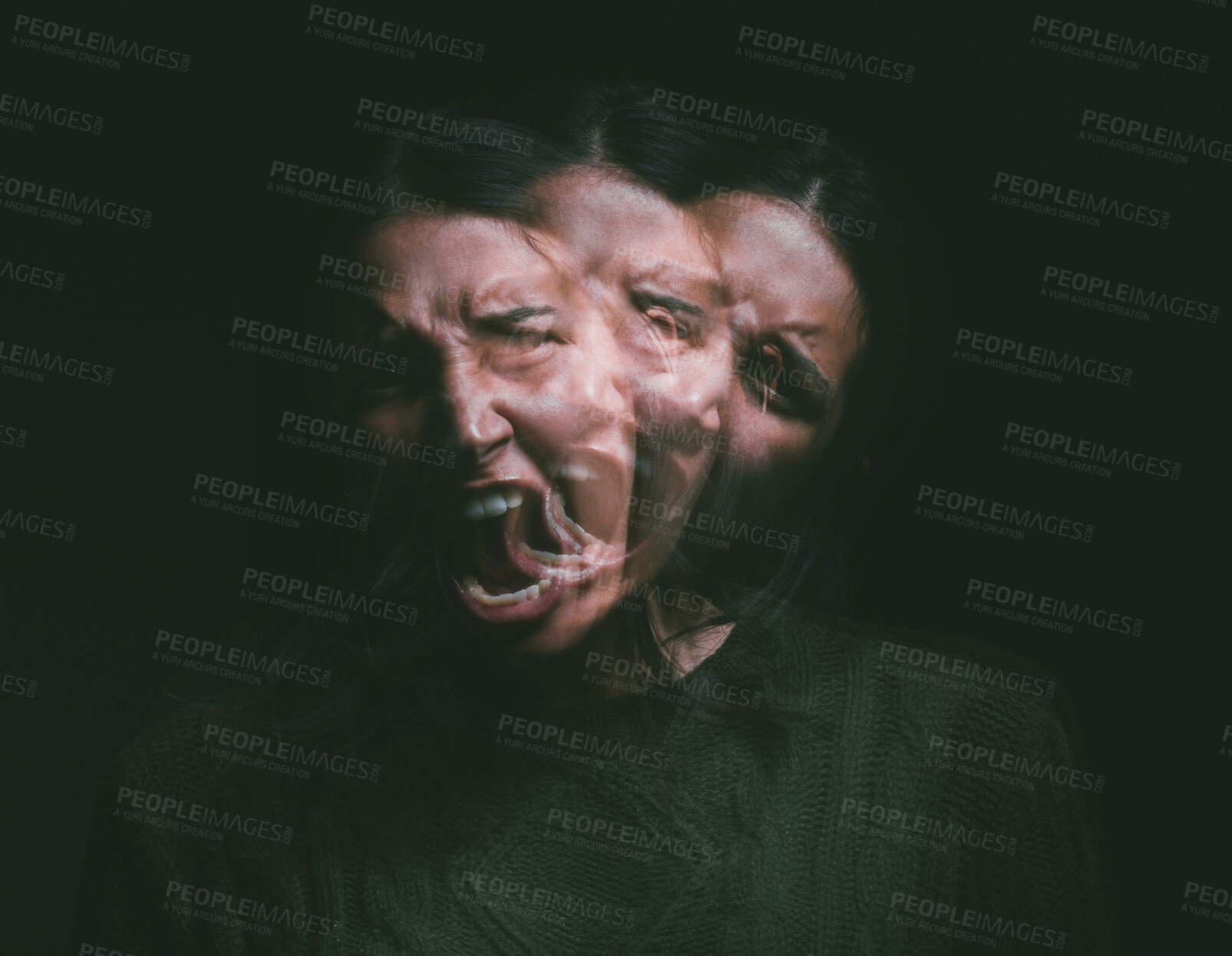 Buy stock photo Studio shot of a young woman experiencing mental anguish and screaming against a black background