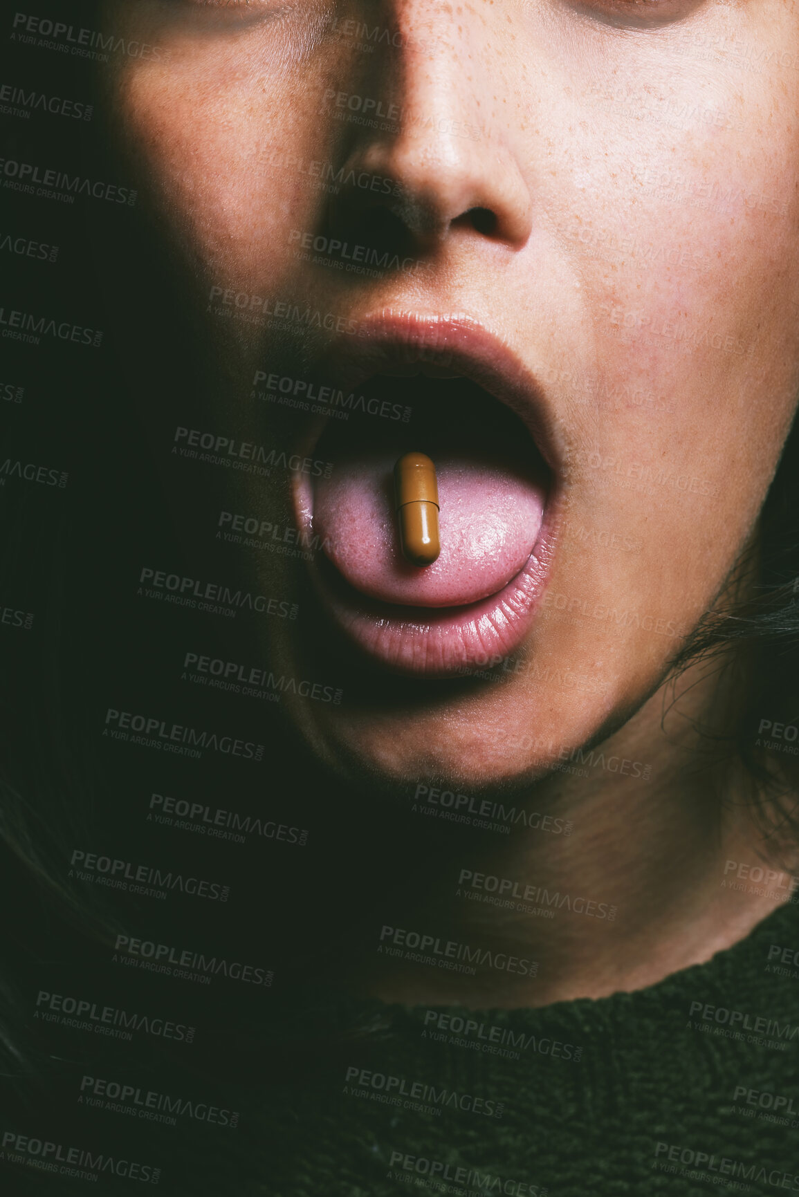 Buy stock photo Drug, mouth and woman with tablet, in studio for medication, relief or healthcare against a dark background. Tongue, addict and person taking medical supplement, vitamin pill or substance abuse