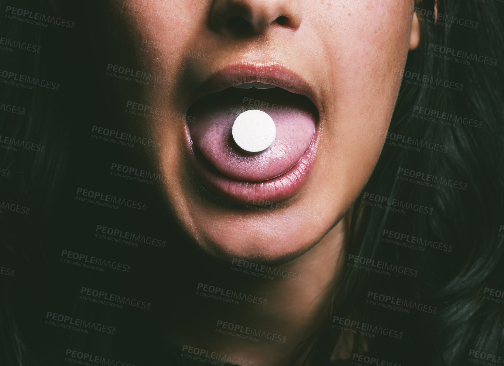 Buy stock photo Drug, person tongue and pills in studio for prescription, depression and medicine for sadness management. Woman, mouth and tablets in dark background for anxiety, mental health or wellness by closeup