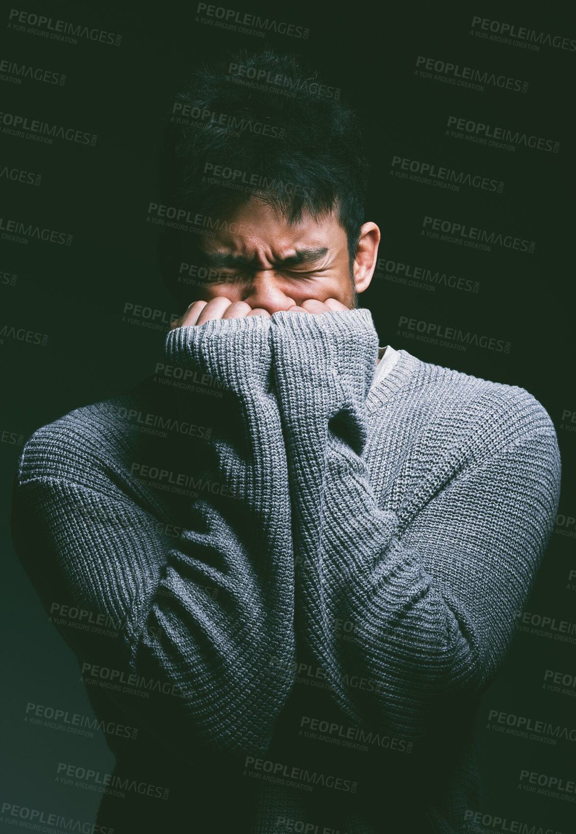 Buy stock photo Stress, crying and man in dark studio with hands on face in fear, nightmare and mental health trauma. Angry, scared and frustrated person with depression, anxiety and terror on black background
