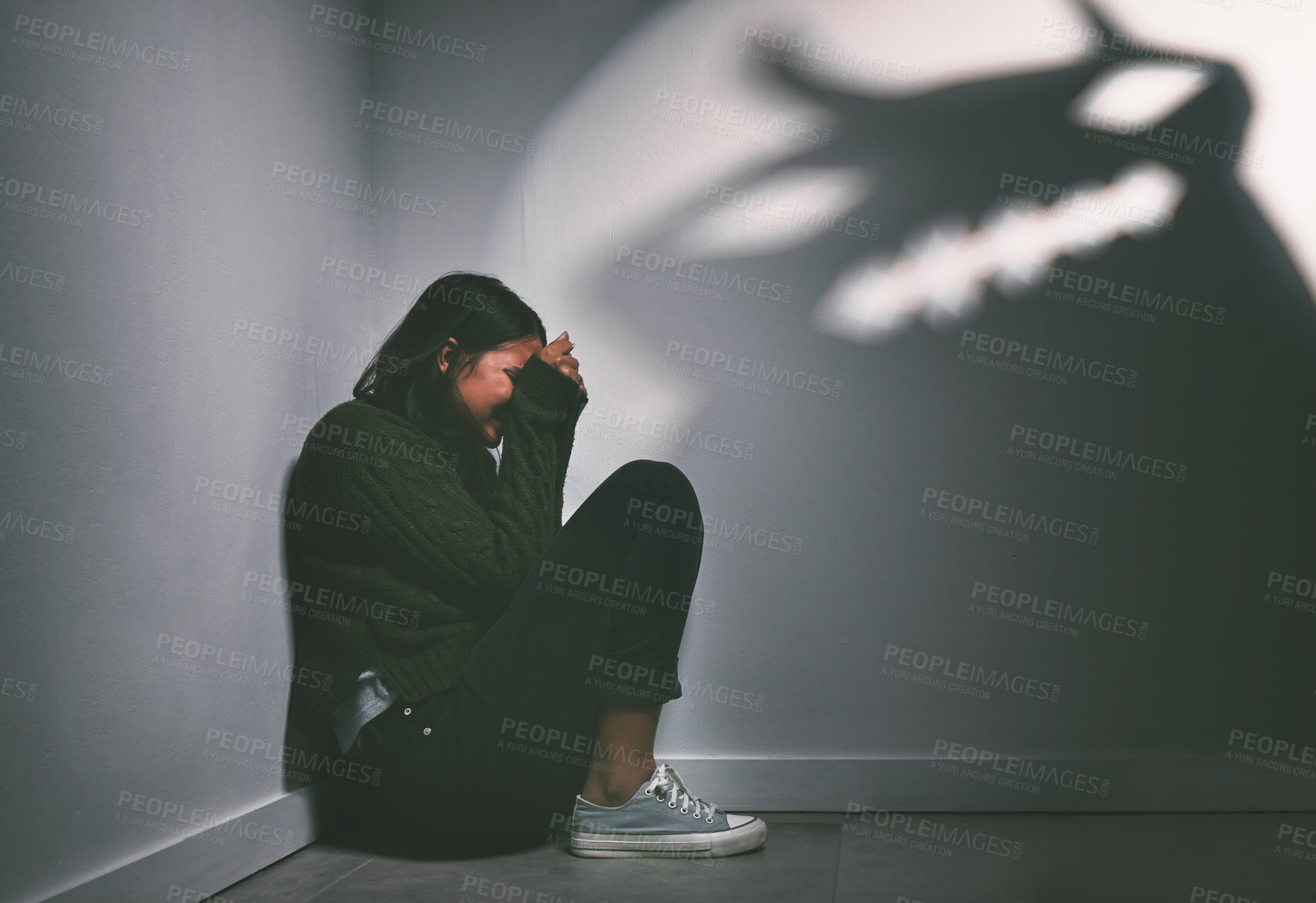 Buy stock photo Scared, alone and woman for crying in dark room, bipolar disorder and hopeless with thoughts of trauma. Mental health, depression and anxiety of female person with sadness, phobia and schizophrenia