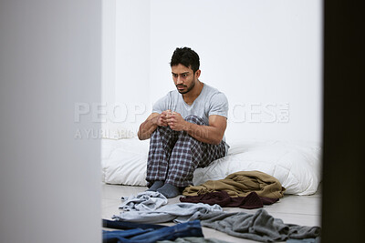 Buy stock photo Shot of a scared male sitting in a mental asylum