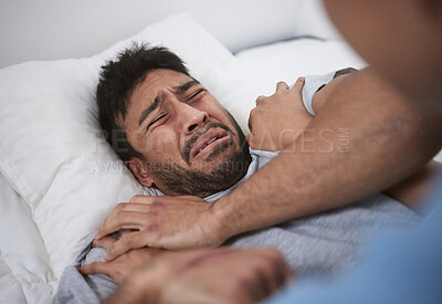 Buy stock photo Shot of a young man crying in a mental asylum