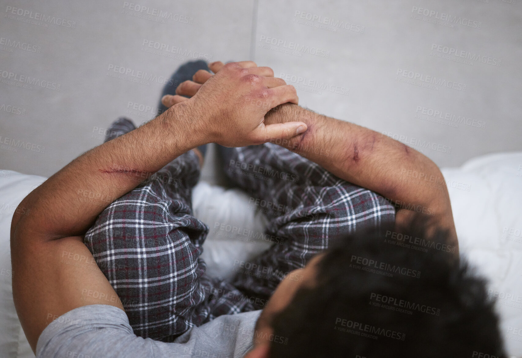 Buy stock photo Shot of a unrecognizable man sitting in a mental asylum