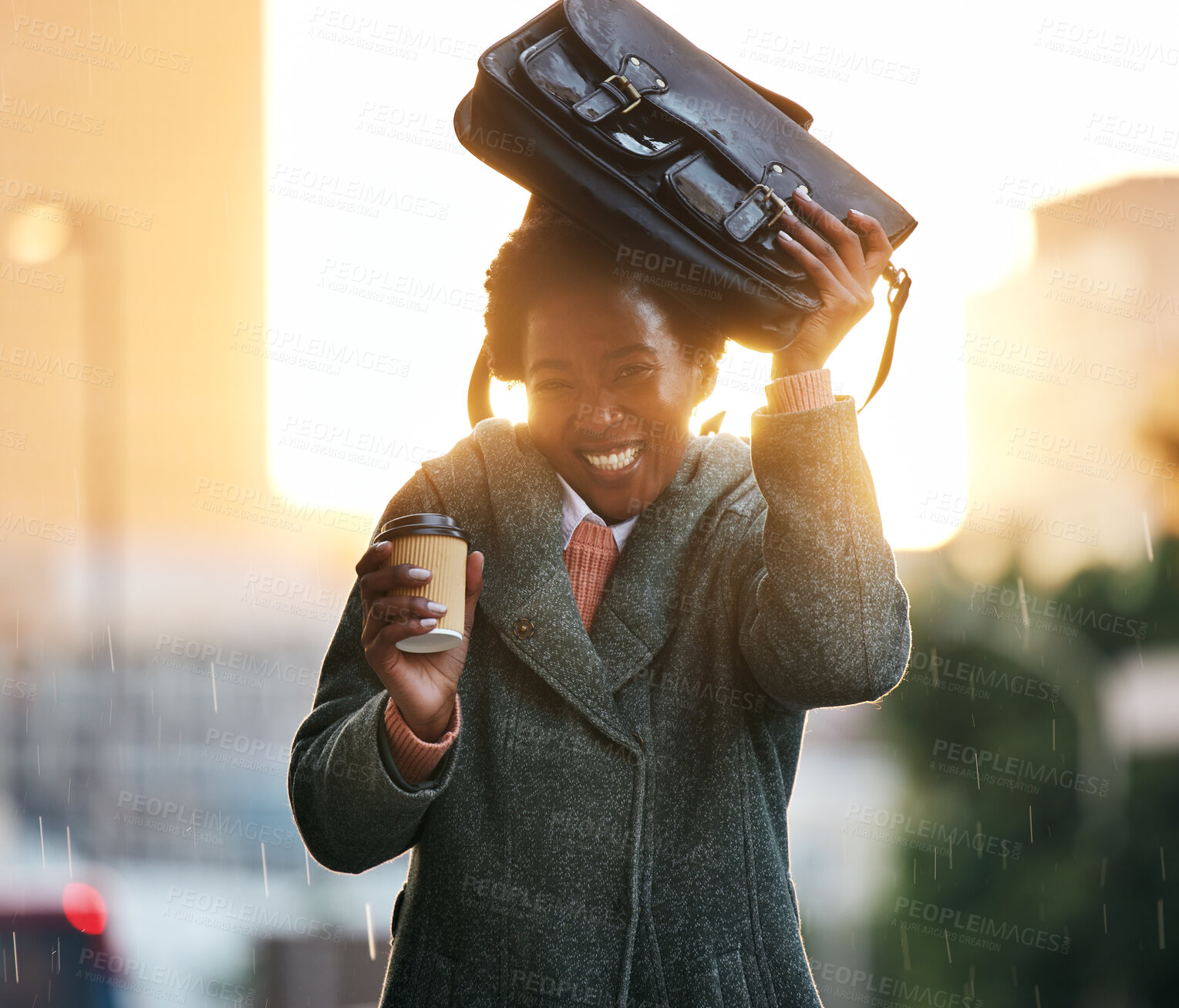 Buy stock photo Portrait, rain and African businesswoman with bag, smile and cover with coffee in city with travel for work. Water, weather and happy in street for insurance, career and unlucky walking in New York 