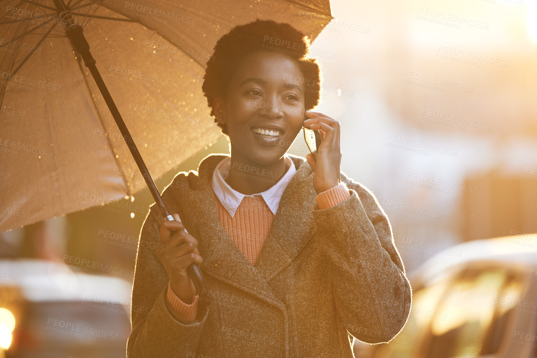 Buy stock photo Business, black woman and phone call with umbrella in outdoor rain for communication, walk and travel to work. Happy, African and person with mobile in winter for commute, feedback and update