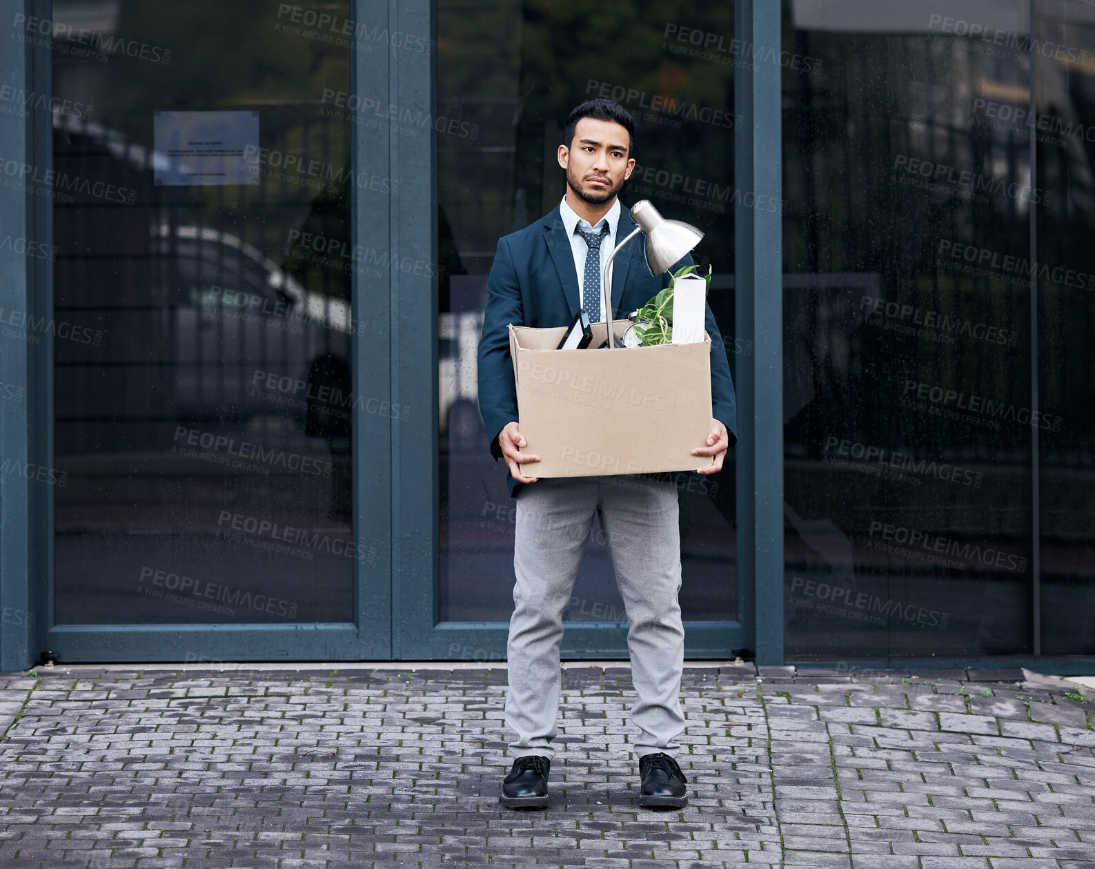 Buy stock photo Depression, economy and box with a jobless business man walking outdoor in the city alone. Financial crisis, unemployment and fired with a young asian male employee looking sad in an urban town