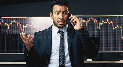 Buy stock photo Shot of a young businessman making a phone call in order to monitor the stock market