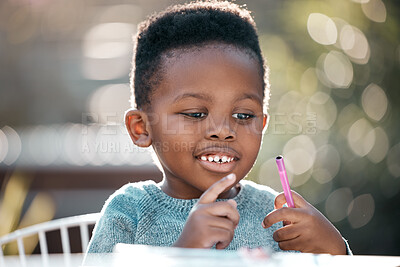 Buy stock photo Education, face and homework with African boy in garden of home for child development or growth. Happy, face and school with adorable young child outdoor in summer for learning or problem solving