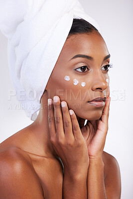 Buy stock photo Woman, cream and serious for skincare with routine in studio on white background and satisfied with results. Natural, beauty and moisturizer with confidence for transformation, facial and treatment