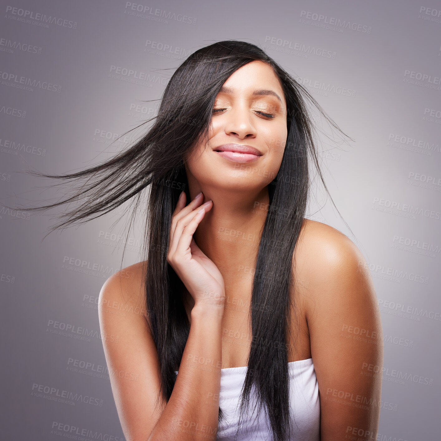 Buy stock photo Salon, hair care and happy woman in studio with eyes closed for keratin, shampoo or natural cosmetics on gray background. Beauty, wind and hand of model for satisfaction, growth or collagen shine