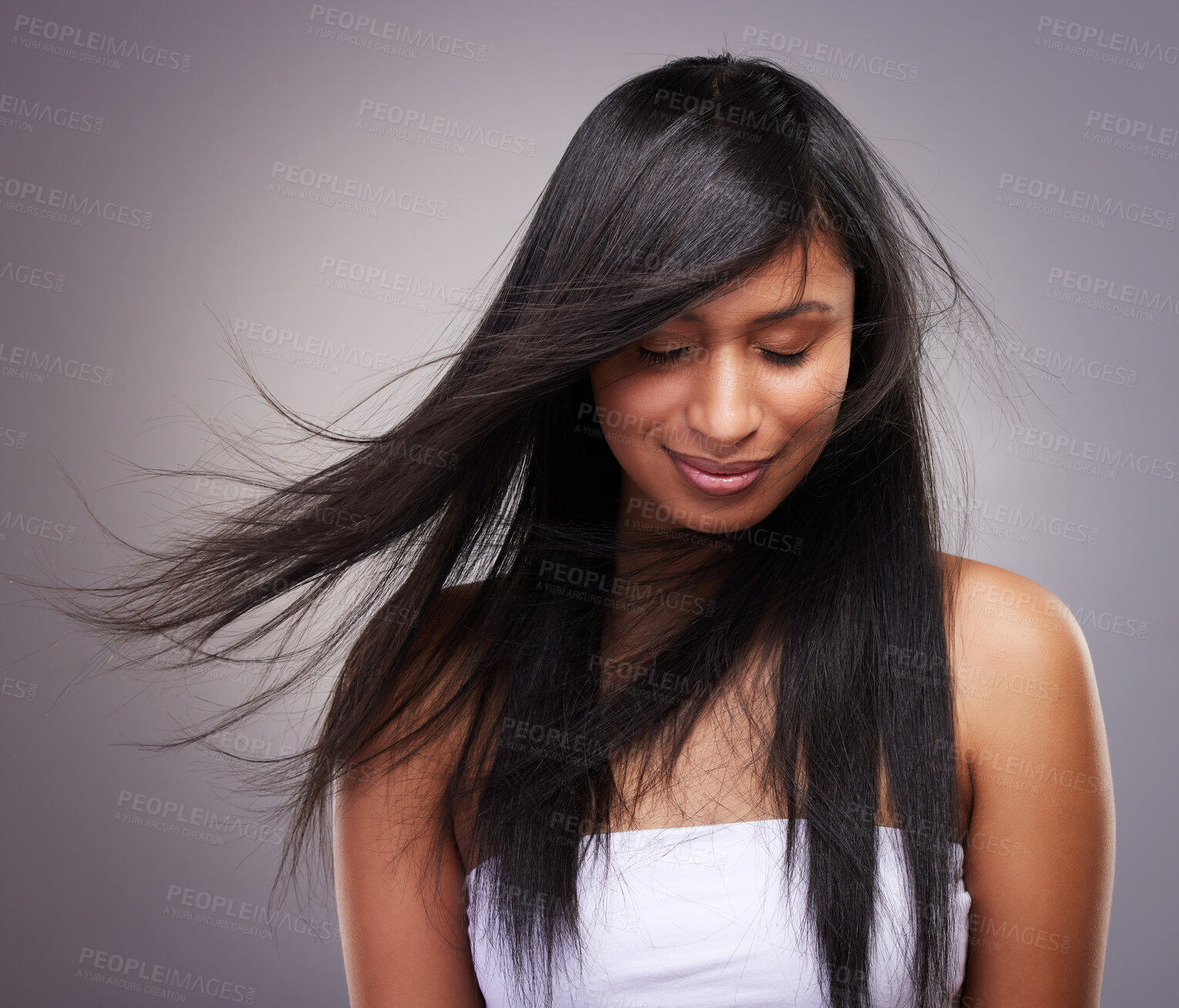 Buy stock photo Haircare, wind and woman in studio with eyes closed for keratin treatment, shampoo or cosmetics on gray background. Hairstyle, salon and model with beauty for satisfaction, growth or collagen shine