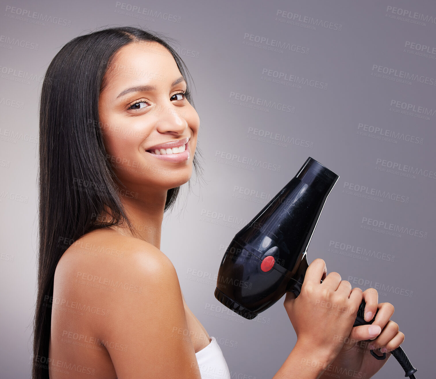 Buy stock photo Cosmetics, woman and happy portrait with hairdryer in studio grey background for wellness and self care. Female person, heat treatment and smile with equipment isolated on backdrop for salon shine