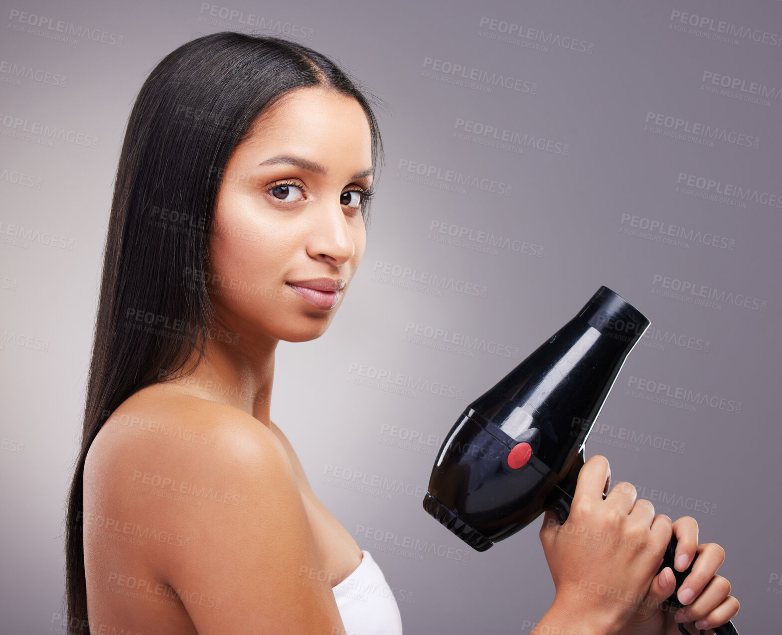 Buy stock photo Cosmetics, woman and portrait with hairdryer in studio grey background for wellness and self care. Female person, heat treatment and equipment isolated on backdrop for salon shine, style and keratin