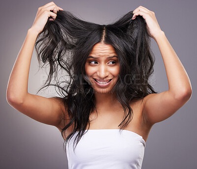 Buy stock photo Stress, problem and woman in studio with hair loss for grooming mistake, itchy scalp and growth fail. Confused, model girl and fear for alopecia crisis and disaster with split ends by grey background