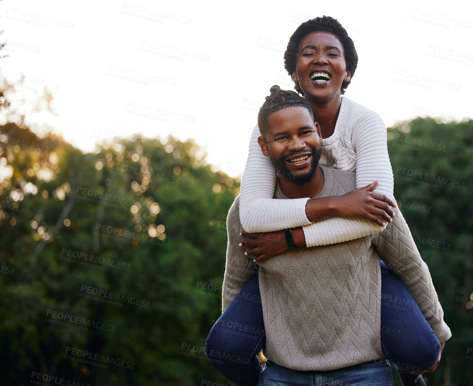 Buy stock photo Piggyback, portrait and happy black couple at park for anniversary date or honeymoon romance with smile. Laugh, hug and African people in nature with support, care and love on holiday fun in garden 